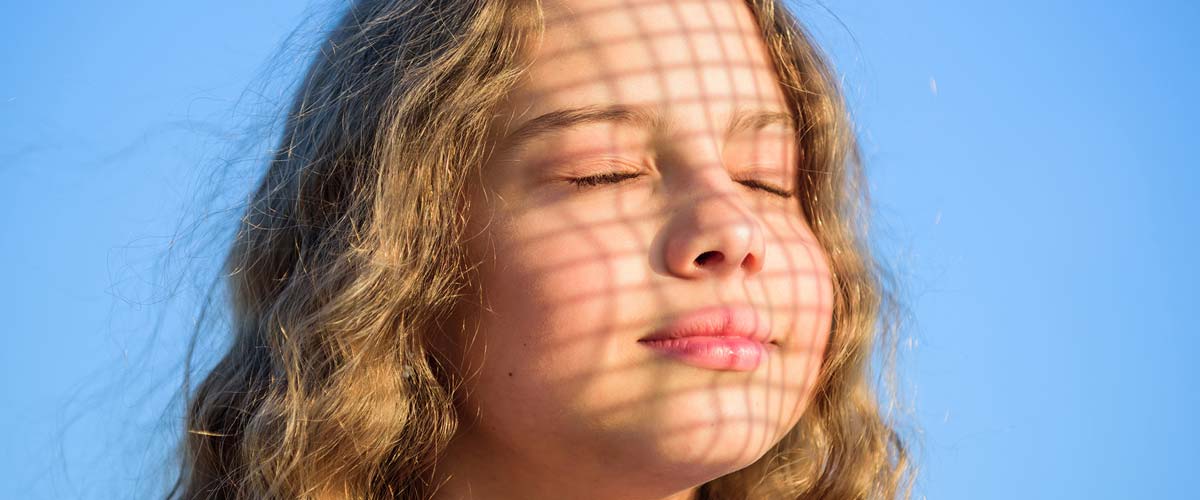 portrait of girl basking in the sun
